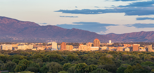 wide shot of downtown albuquerque with the mountains in the background
