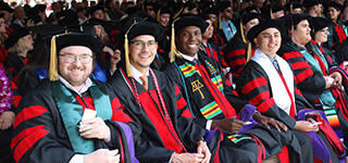 law school students in robes at graduation ceremony