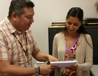 Leia Viscarra working with the Director of Operations, Vincent L. Knight (UNM Law ‘04) on drafting code for the Pueblo of Zia.