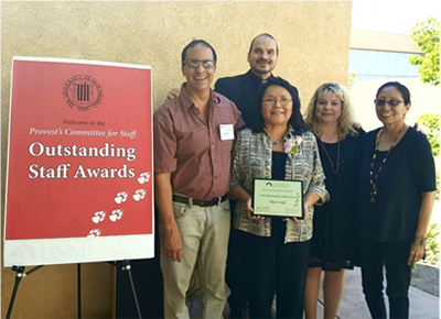 L to R: Steven Peralta, Chair of the Provost’s Committee for Staff and Director of Academic Advisement at the UNM School of Engineering; Professor John LaVelle, UNM School of Law; award winner Mitzi Vigil, Administrator of the Law and Indigenous Peoples Program at UNM School of Law; Melissa Vargas, Strategic Planner and Director of Staff for the UNM Provost's Office; and Professor Christine Zuni Cruz, Associate Dean for Indian Law and Director of the Law and Indigenous Peoples Program at UNM School of Law.