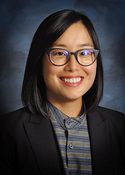 headshot of Laura Creech, asian woman with long dark hair and glasses