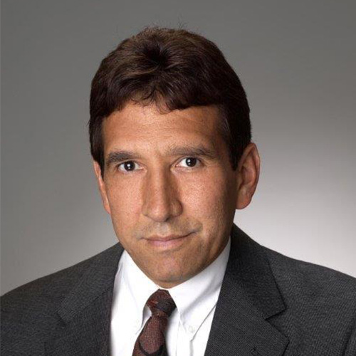 David Martinez, middle aged man in suit and tie outside