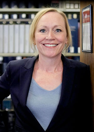 Dean Camille Carey standing in the Law Library