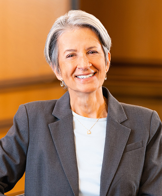 Linda Vanzi, woman with short grey hair, dressed professionally in a courtroom setting