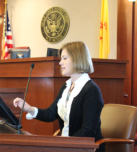 Anne Minard (’15) experiments with the touch-screen technology on the courtroom monitor. 