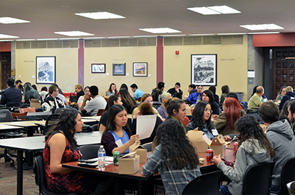 High school students interacted with legal professionals and law students during lunch in the forum.