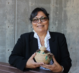 Professor Cheryl Fairbanks holds a basket she uses as a tool for Circles of Peace.