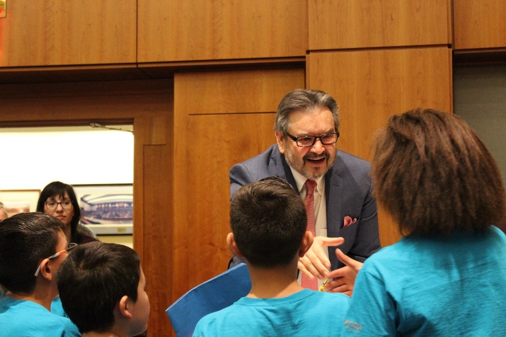 Senator Carlos R. Cisneros of District 6 greets his Wild Friends on the floor of the Senate.  Photo by Sal Guardiola II