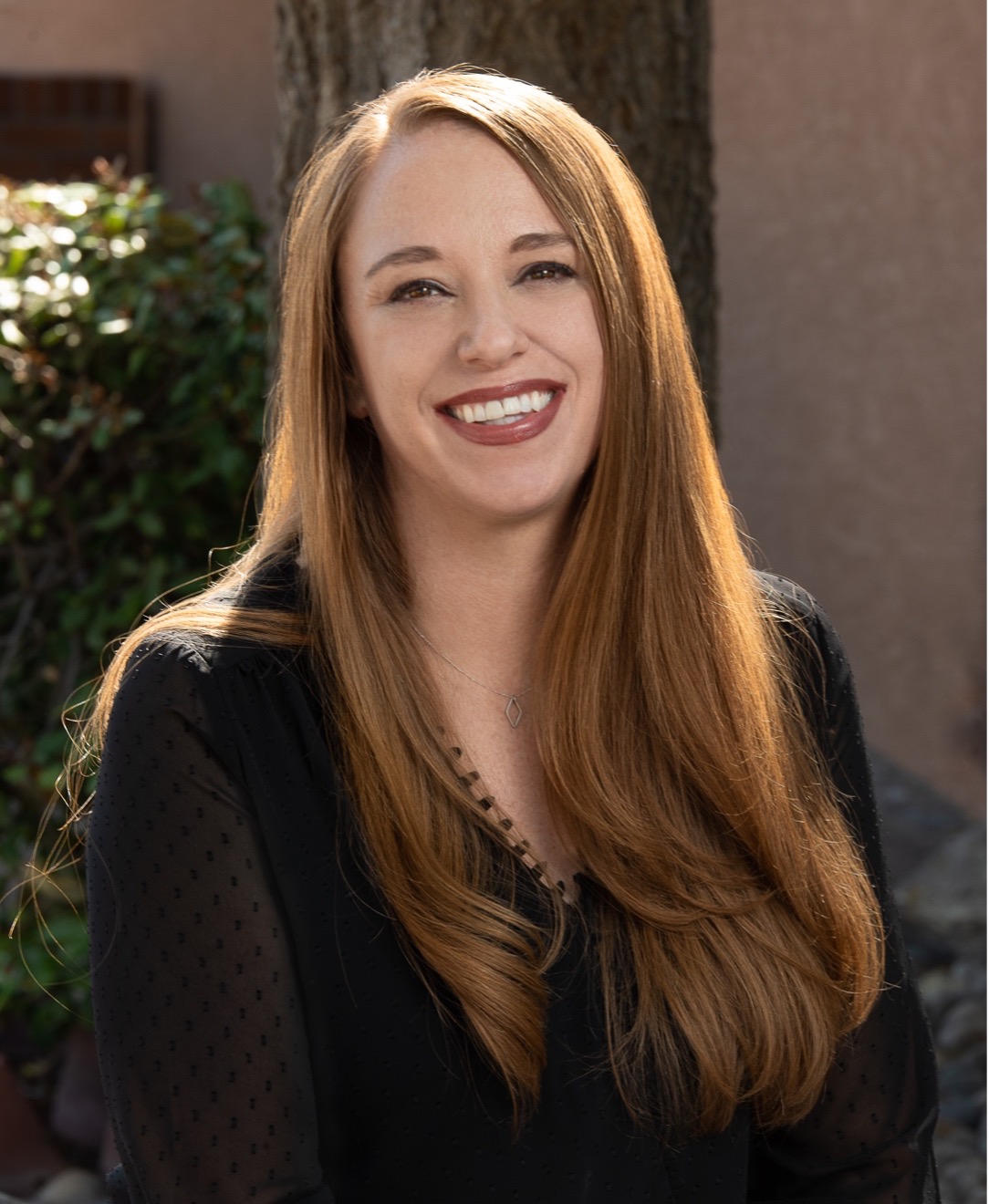 alison cimino, adult woman with long brown hair dressed professionally