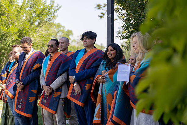 students in blanket ceremony