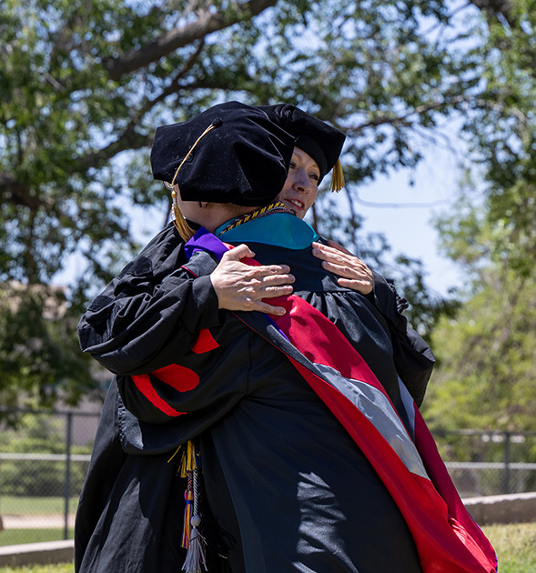 students hugging