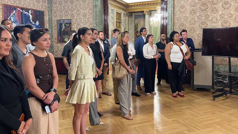 Students in a ballroom listening to a presentation